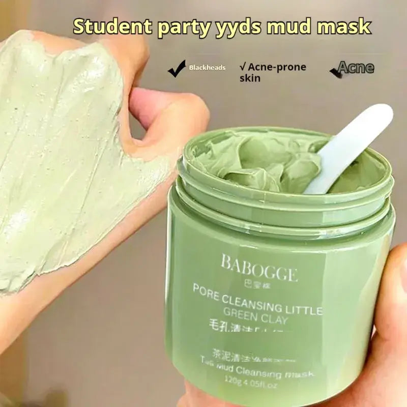 Tea mud cleansing facial mask in a container with application on hand for deep pore skincare and acne treatment.