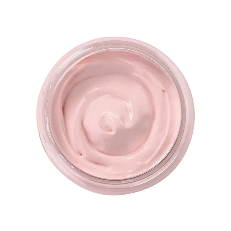 Pink clay mud mask in a jar, showcasing its smooth texture and light pink color for deep cleansing skincare.